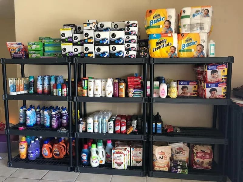 Full stockpile shelves — paper towels, detergent & toiletries